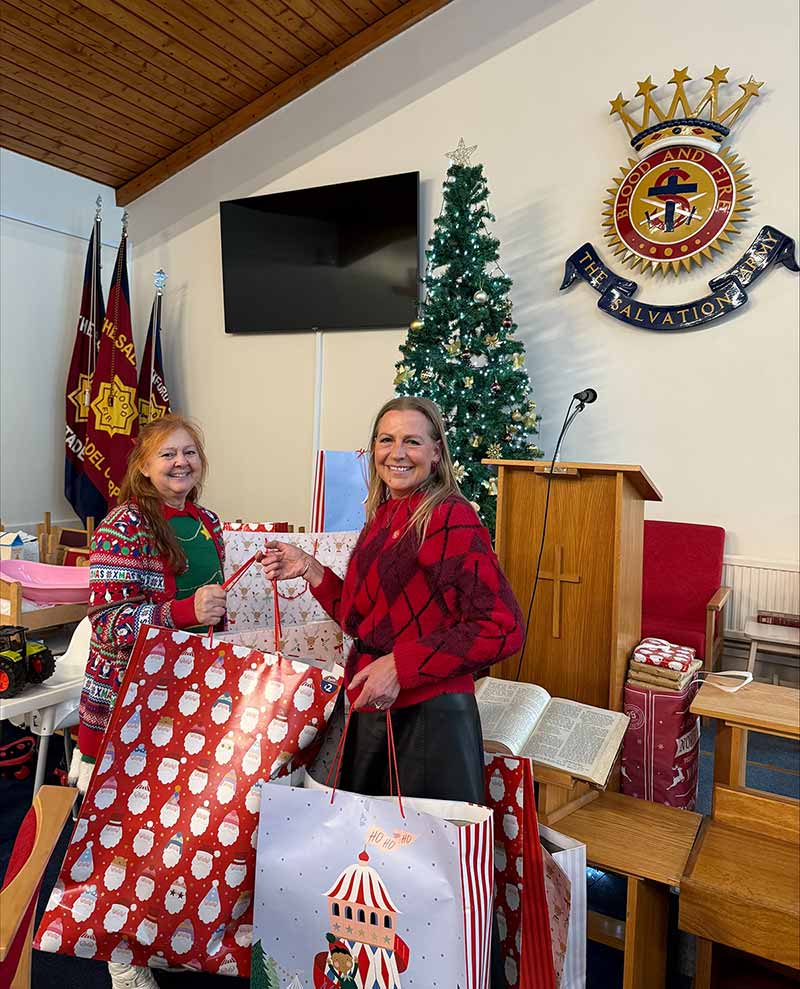Denise Sheridan delivering donated presents to The Salvation Army